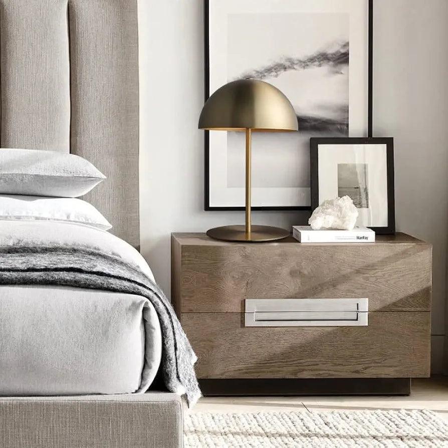Lamp placed beside bed on table – cozy luxury bedroom styling