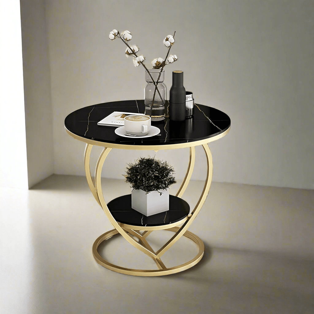 Heart-shaped black coffee table with gold metal frame – studio shot