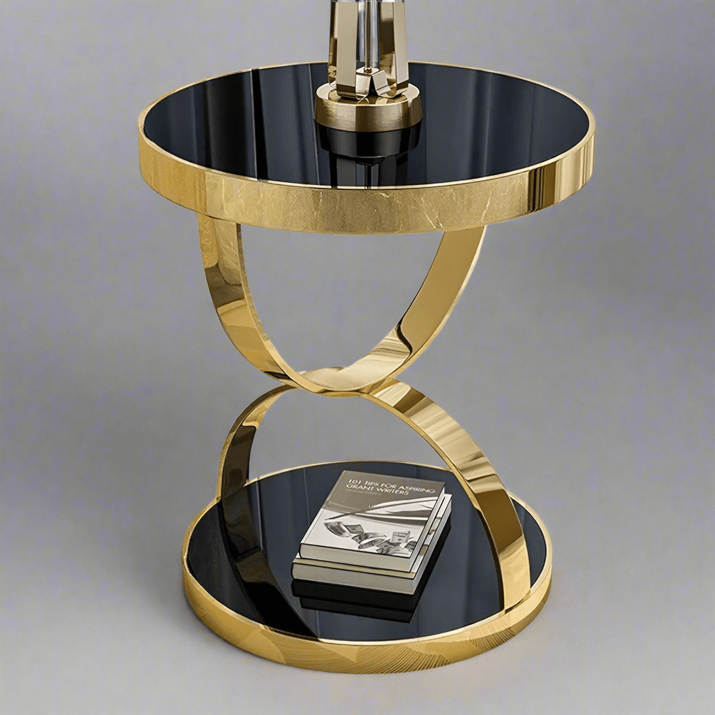 Elegantly designed gold accent coffee table with a glossy black top and stylish geometric base