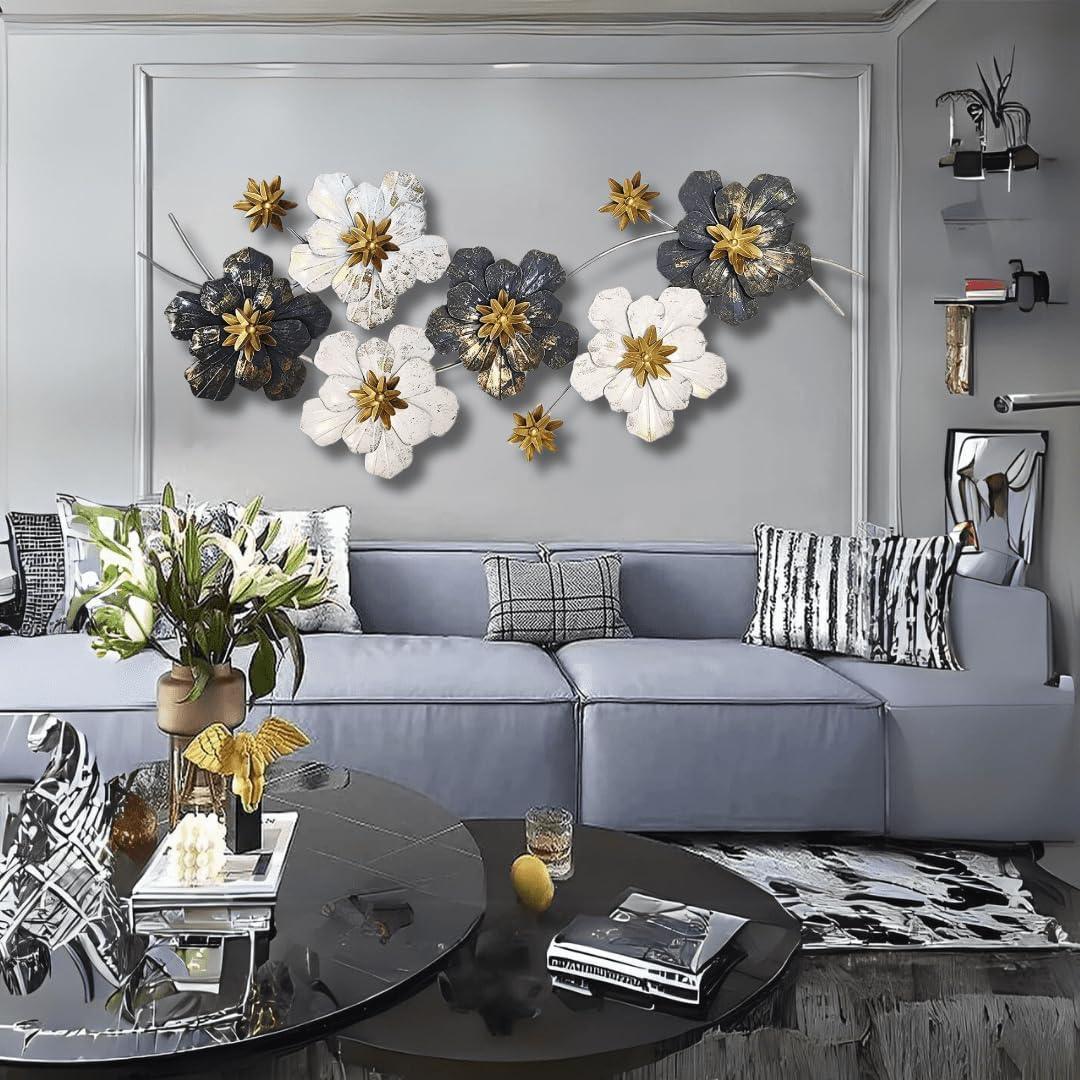 N I CREATIONS metal wall art decor featuring floral designs in gold, black, and white above a modern sofa