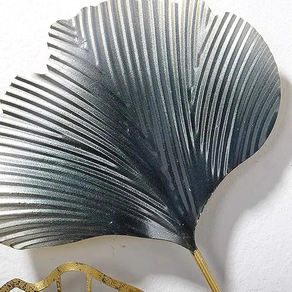 Elegant Iron wall sculpture featuring a leaf design with detailed texture and metallic finish