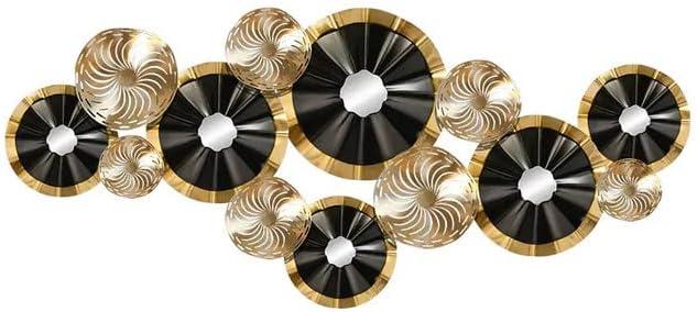 Isolated image of black & gold modern metal wall sculpture with white background