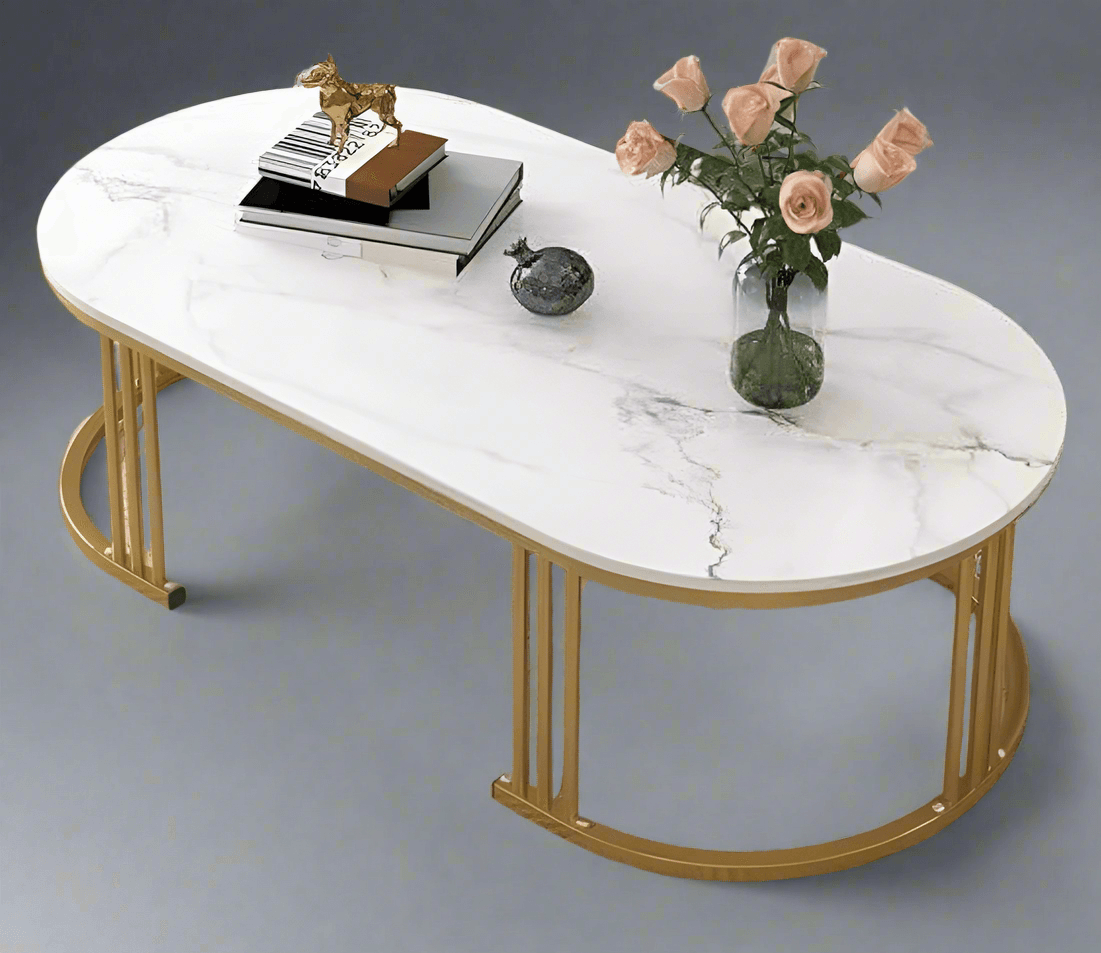Elegant modern coffee table with a marble top and gold metal legs, featuring decor items and flowers