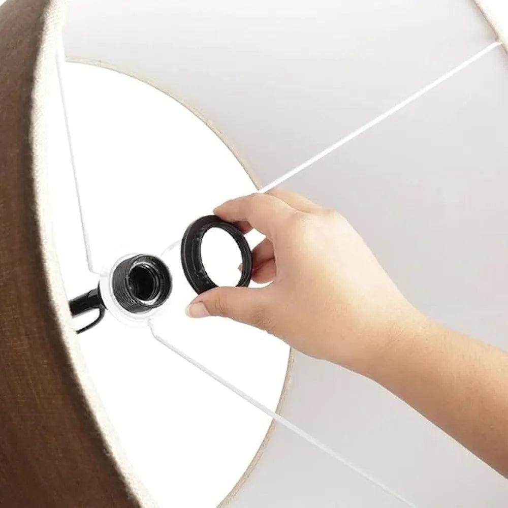 Hand adjusting the shade of a N I CREATIONS modern floor lamp for stylish home décor
