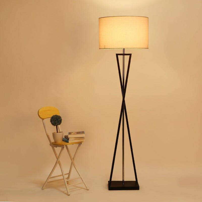 N I CREATIONS Modern Floor lamp with a sleek design and warm light beside a wooden chair