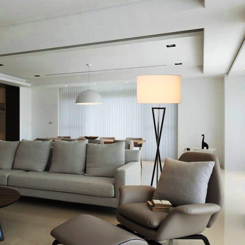 Stylish living room featuring a modern floor lamp beside a comfortable sofa and armchair