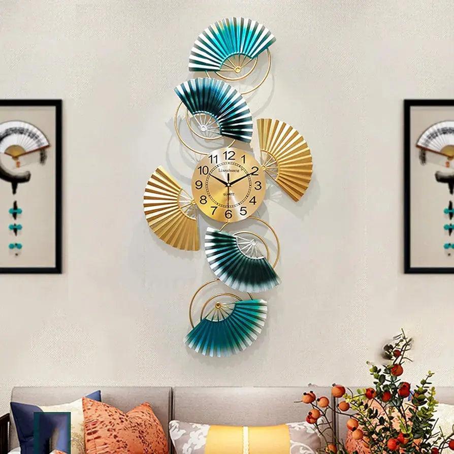 Stylish modern wall clock for living room with gold and teal fan accents and a sleek design
