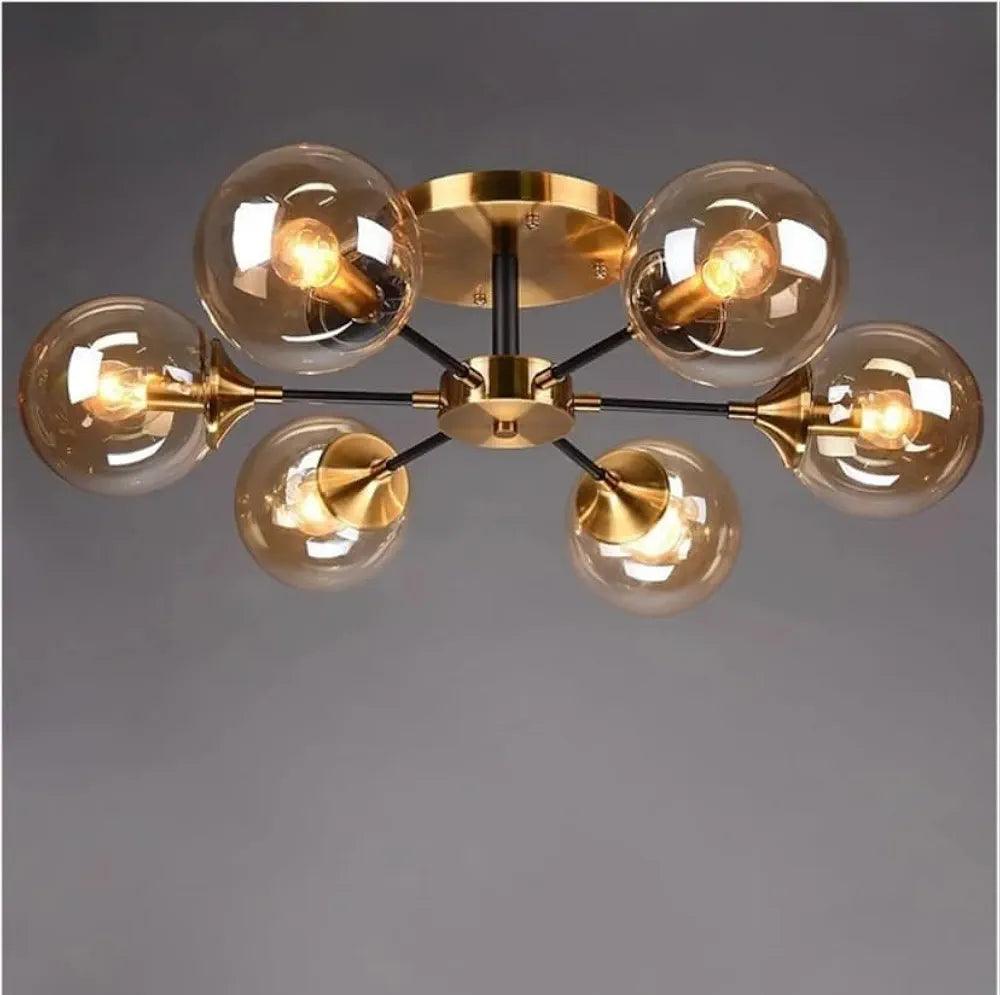 Stylish N I CREATIONS pendant lamp chandelier with six glass globes and a sleek gold finish