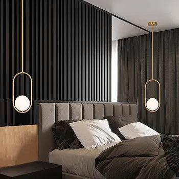 Elegant N I CREATIONS pendant light in gold finish, adding modern charm to a stylish bedroom decor