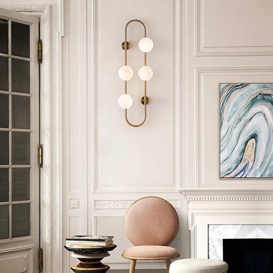 N I CREATIONS modern wall lamp light with four spherical bulbs in a stylish living room setting