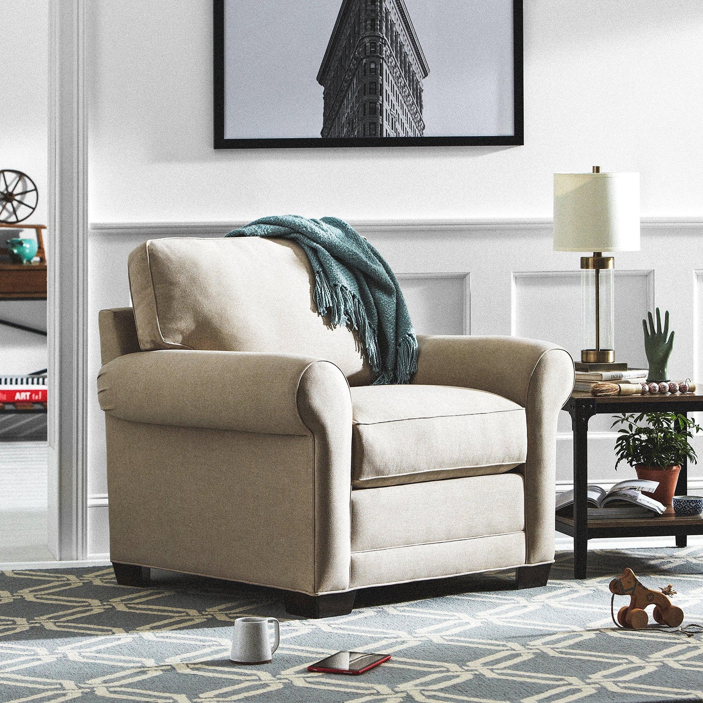 N I CREATIONS stylish table desk lamp next to a cozy armchair in a modern living room setting