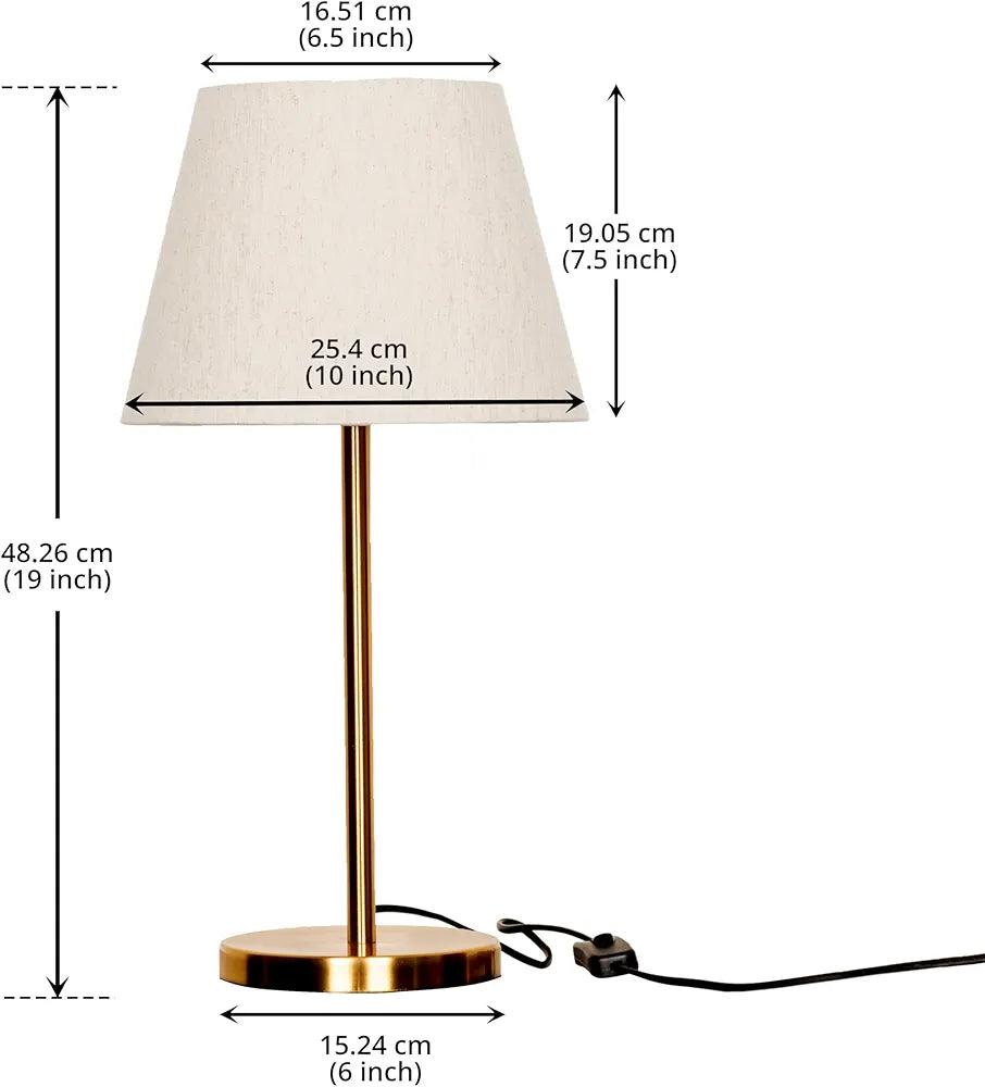 N I CREATIONS Table lamp with a stylish design, featuring a gold base and cream-colored shade