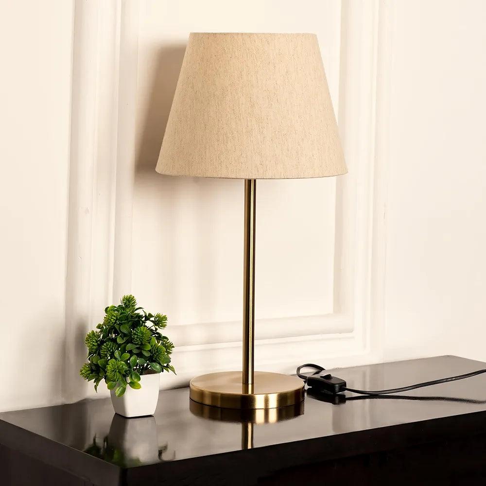 Elegant N I CREATIONS table lamp with a beige shade and a gold metal base for home decor