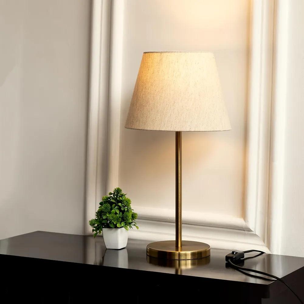 N I CREATIONS Elegant table lamp with a fabric shade and brass base for stylish home decor