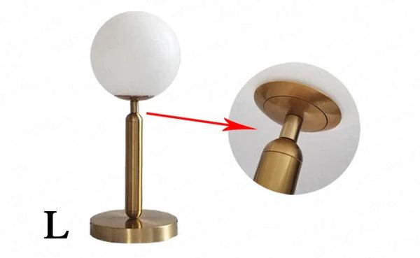 N I CREATIONS Table lamp desk featuring a sleek design with a golden base and frosted globe shade