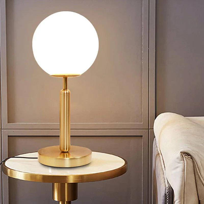 Elegant N I CREATIONS table lamp desk with a round glass shade and gold base for modern home decor