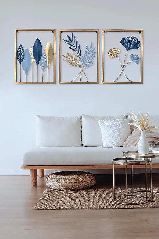 Wall art set featuring framed botanical designs in blue and gold hues for stylish home decor