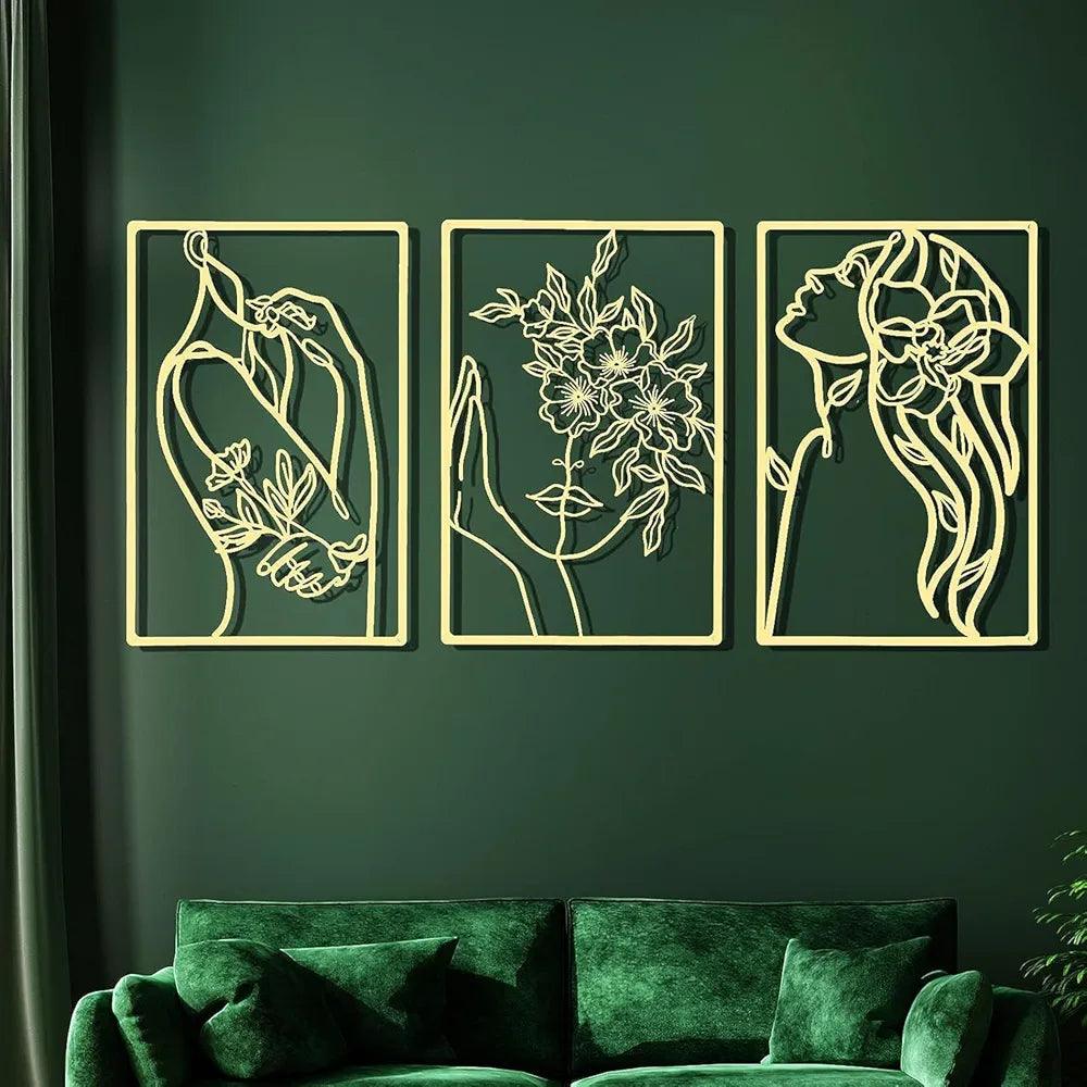 Elegant wall art set by N I CREATIONS featuring three line drawings of women and floral designs