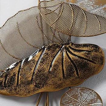 N I CREATIONS wall art featuring intricate metallic leaf design in gold and black tones