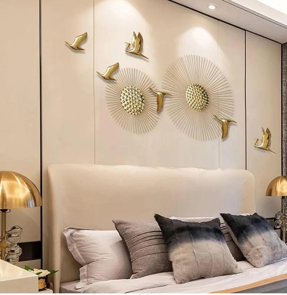Gold plated sun and birds wall decor on cream wall background – perfect for living spaces