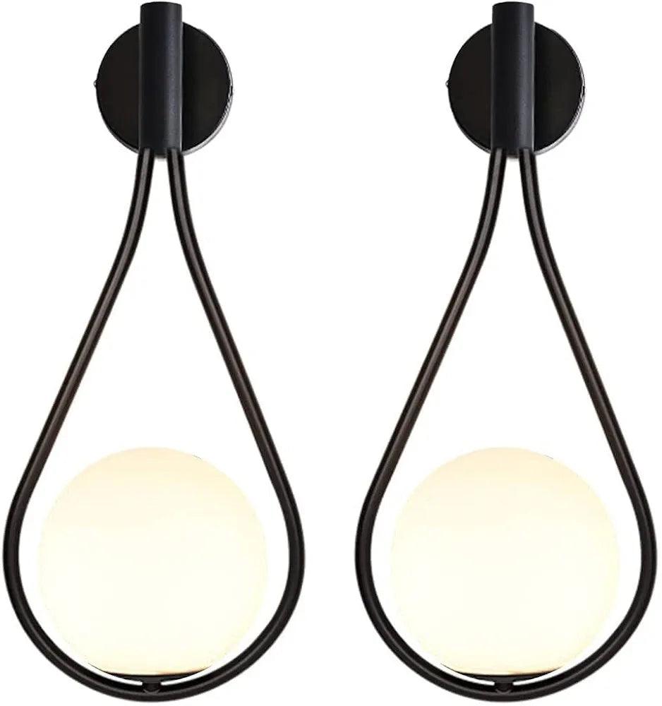 N I CREATIONS modern wall lamp featuring a sleek black design with a round glass shade