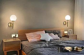Elegant N I CREATIONS wall lamp illuminating a cozy bedroom with soft colors and modern decor