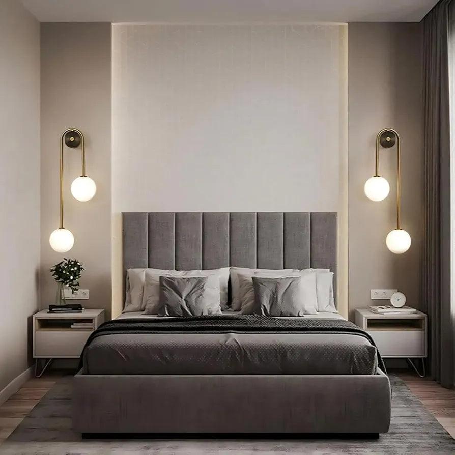 Modern bedroom featuring N I CREATIONS wall lamp light paired with stylish bedside tables and a gray bed