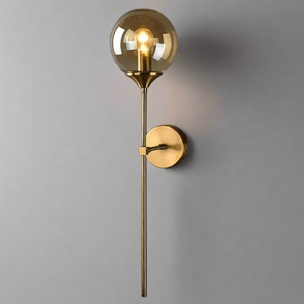 Elegant N I CREATIONS wall light with a gold finish and clear globe design for modern home decor