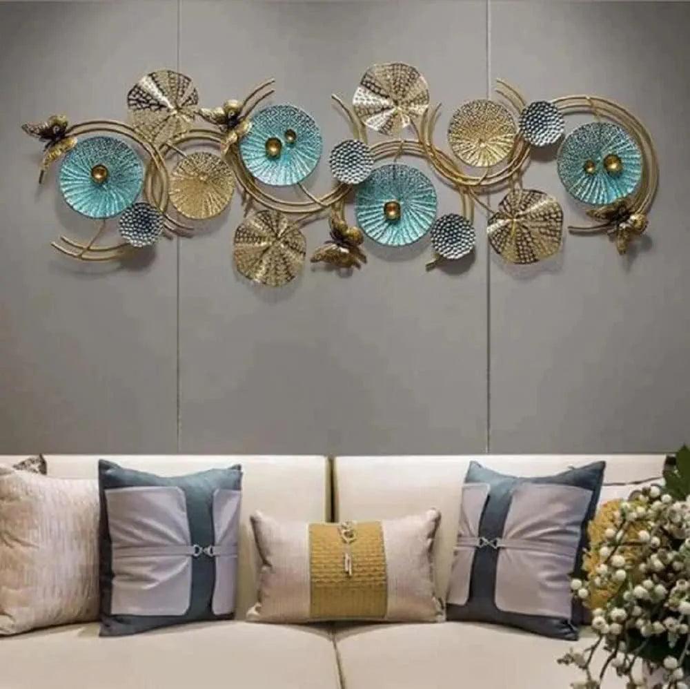 Abstract metal wall sculpture featuring human figures – hung on a modern living room wall
