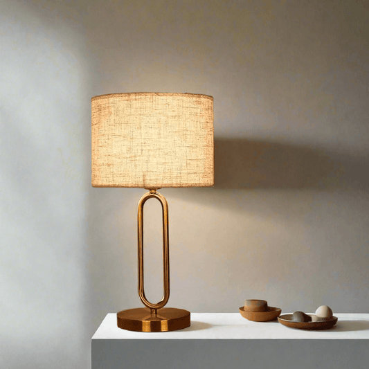 Stylish N I CREATIONS bedside table lamp with a golden base and linen shade, perfect for home decor