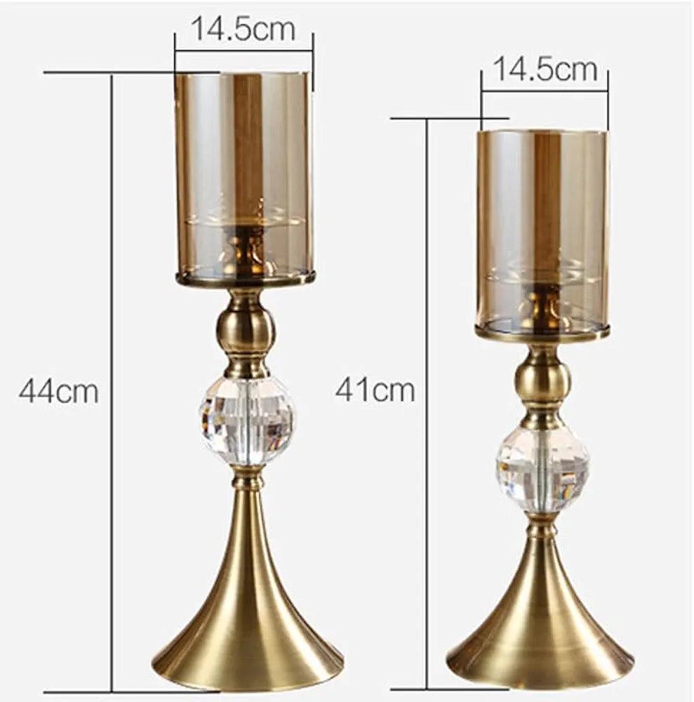 Elegant N I CREATIONS candle holder set with gold finish and glass accents in two sizes