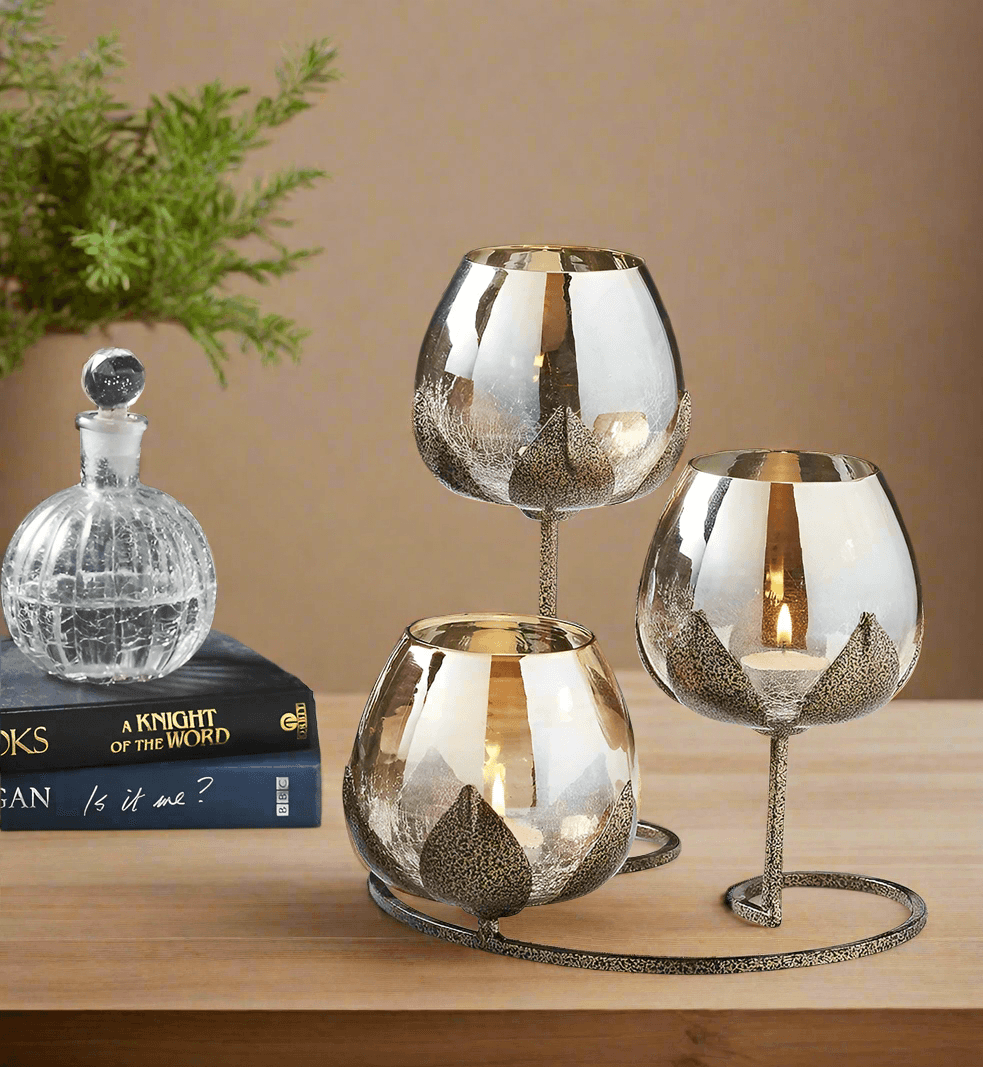 1. Triple gold candlestick holder with glass cups – styled on a wooden table