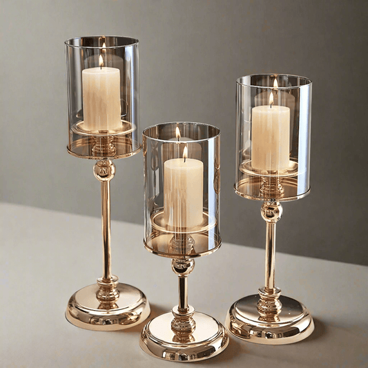 Elegant N I CREATIONS candle holders stand with glass shades and lit candles for home decor