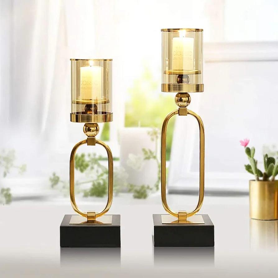 Elegant N I CREATIONS candle light holders in gold and black, perfect for home decor.