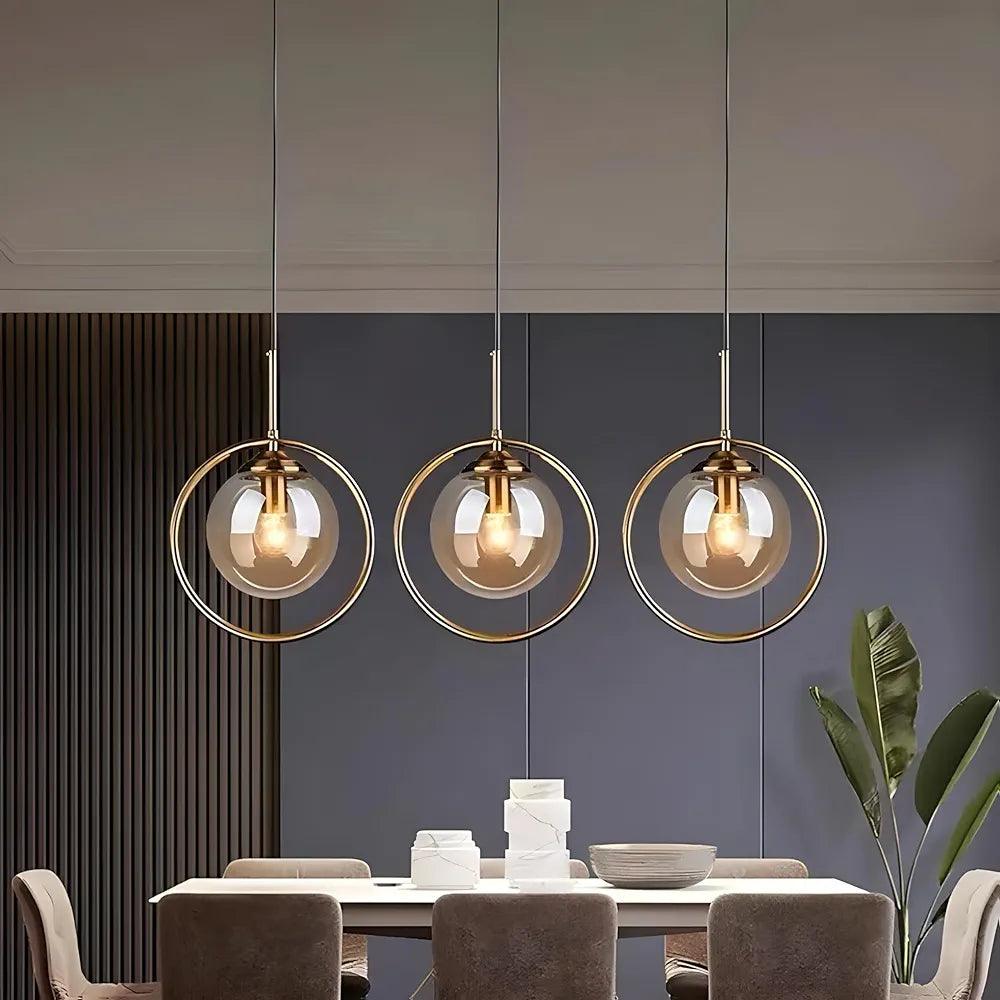 Modern pendant ceiling light trio with glass globes and gold accents for stylish home decor