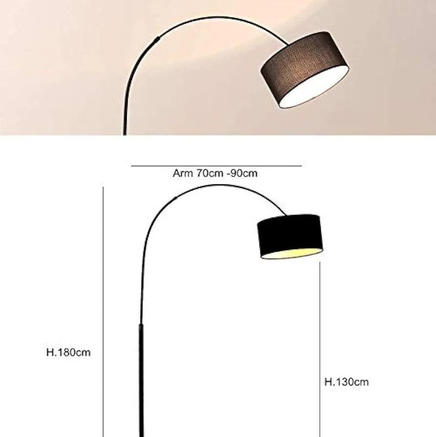 Full-size black arch floor lamp with scale reference — height and base visible.