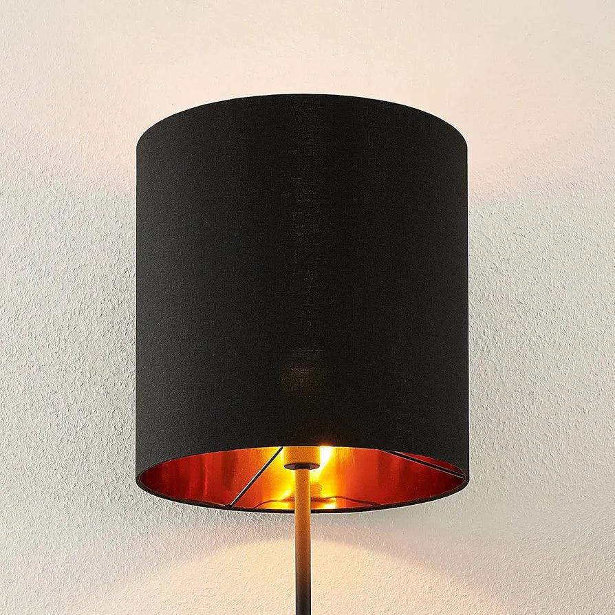 N I CREATIONS Floor Lamp standing with a stylish black shade and warm orange interior