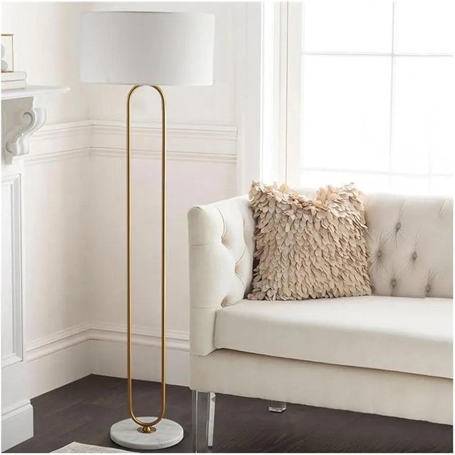 N I CREATIONS elegant floor lamp standing with white shade and gold accents beside a stylish couch