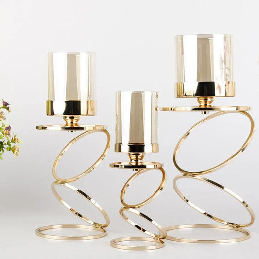 Elegant N I CREATIONS candle holders in gold with a wavy design for stylish home decoration