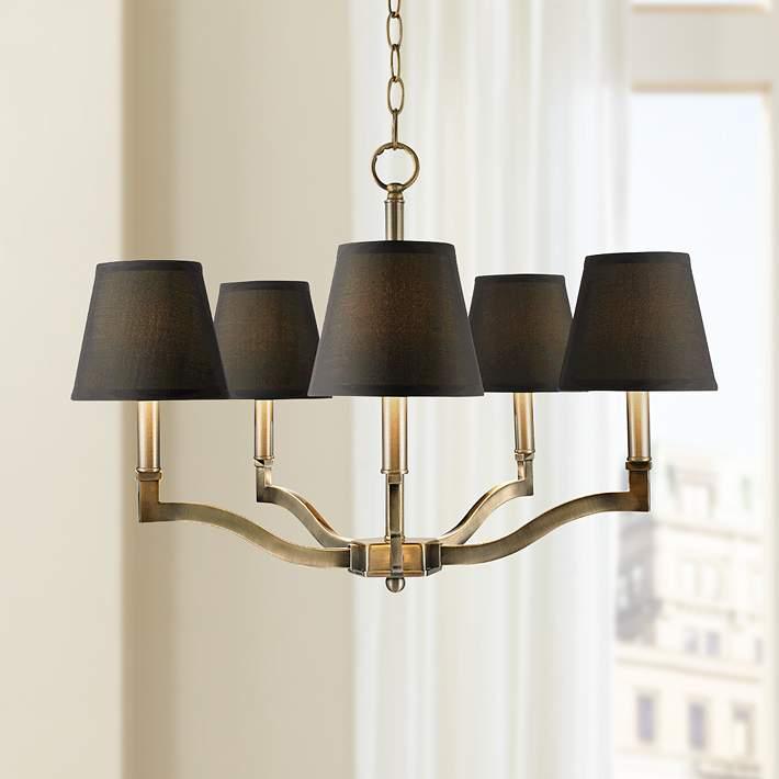 Golden and black chandelier on white background – full clean view