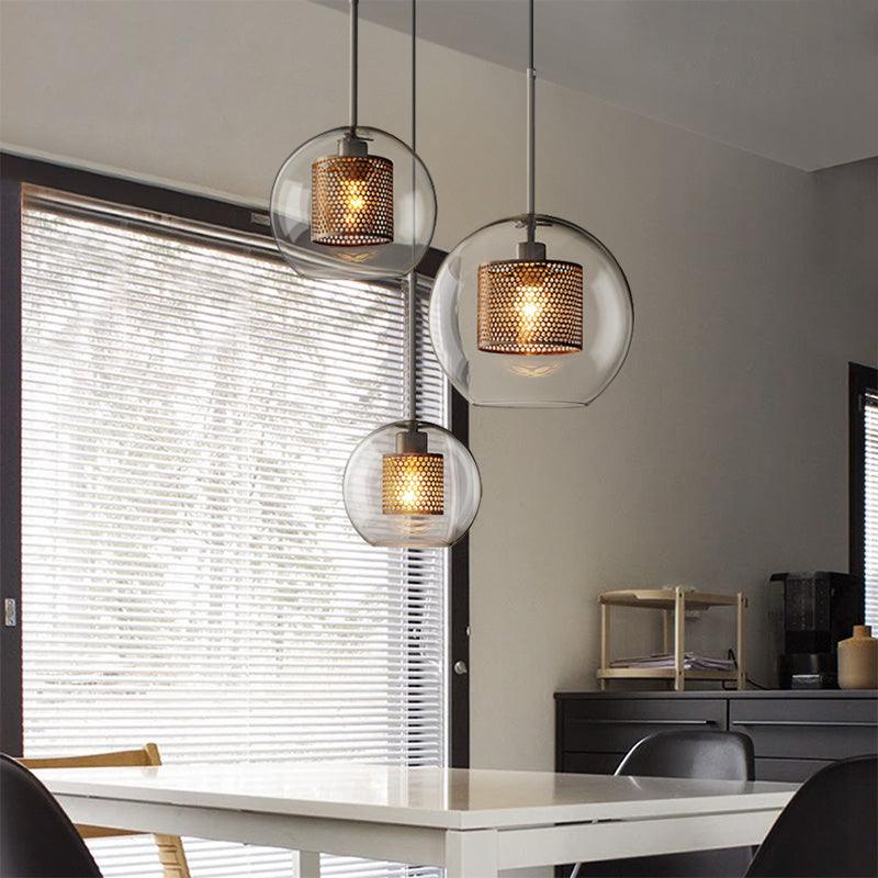Contemporary hanging lights by N I CREATIONS featuring glass and metal designs for modern home decor
