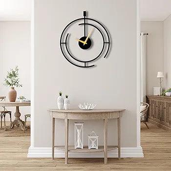 Stylish metal analog wall clock featuring a modern design with gold accents