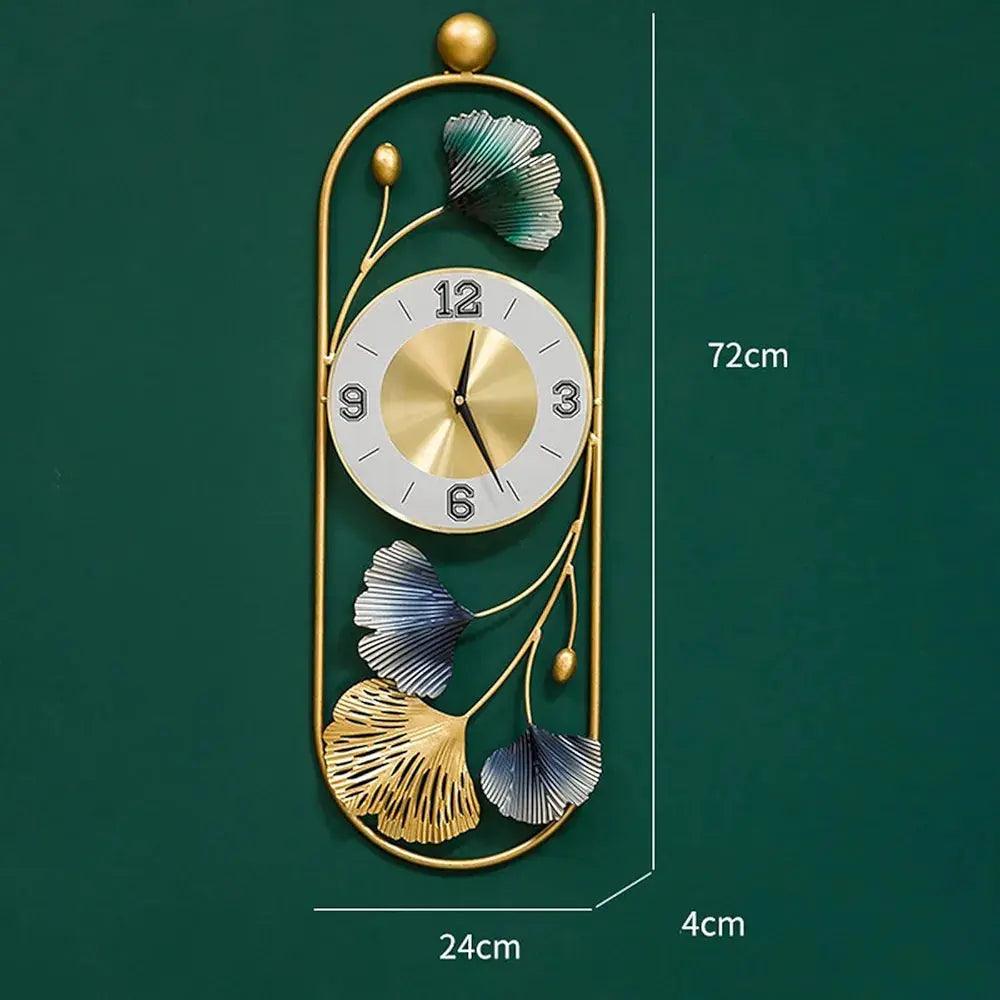 Elegant metal wall clock with floral design in gold and blue tones, measuring 72cm by 24cm