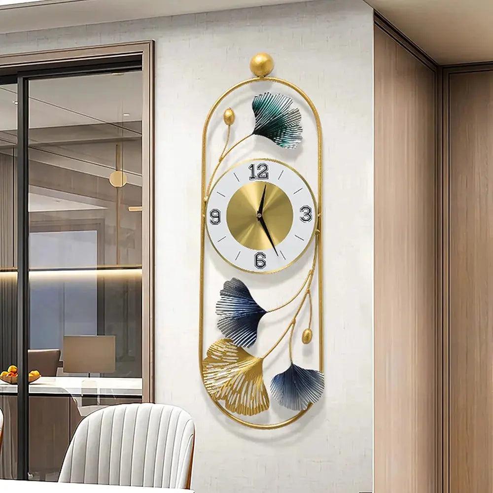 Stylish metal wall clock with golden frame and decorative leaf design for modern home decor