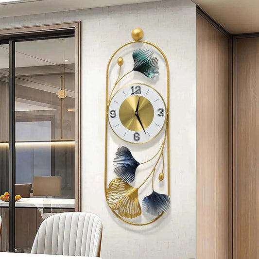 Stylish metal wall clock with golden frame and decorative leaf design for modern home decor