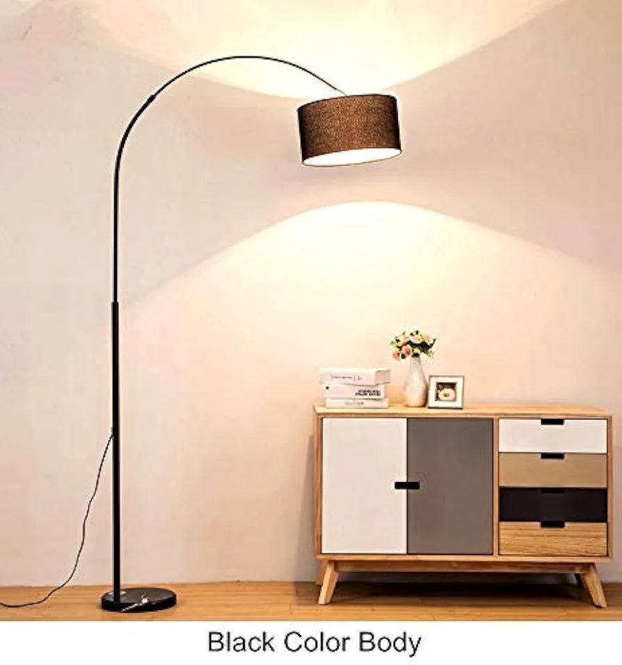 Floor lamp from alternate angle showing curved design and fabric shade.