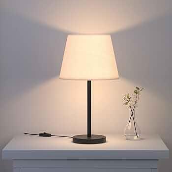 N I CREATIONS Modern lamp on a table with a soft glow, perfect for home decoration