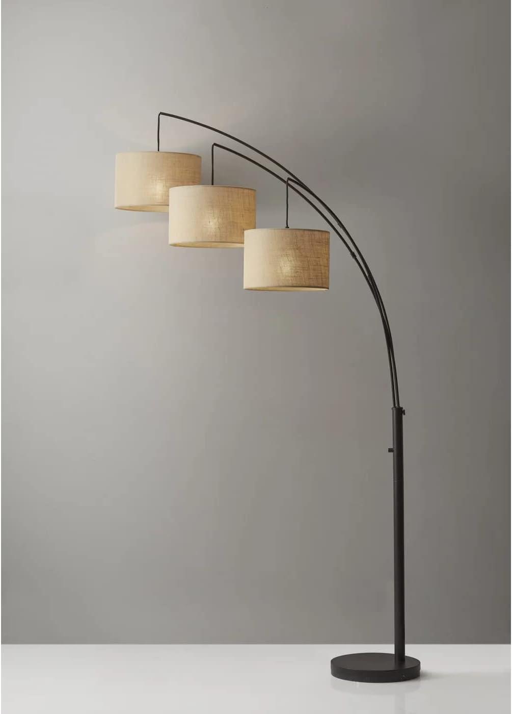 Modern standing floor lamp with black frame and beige burlap shade – side angle