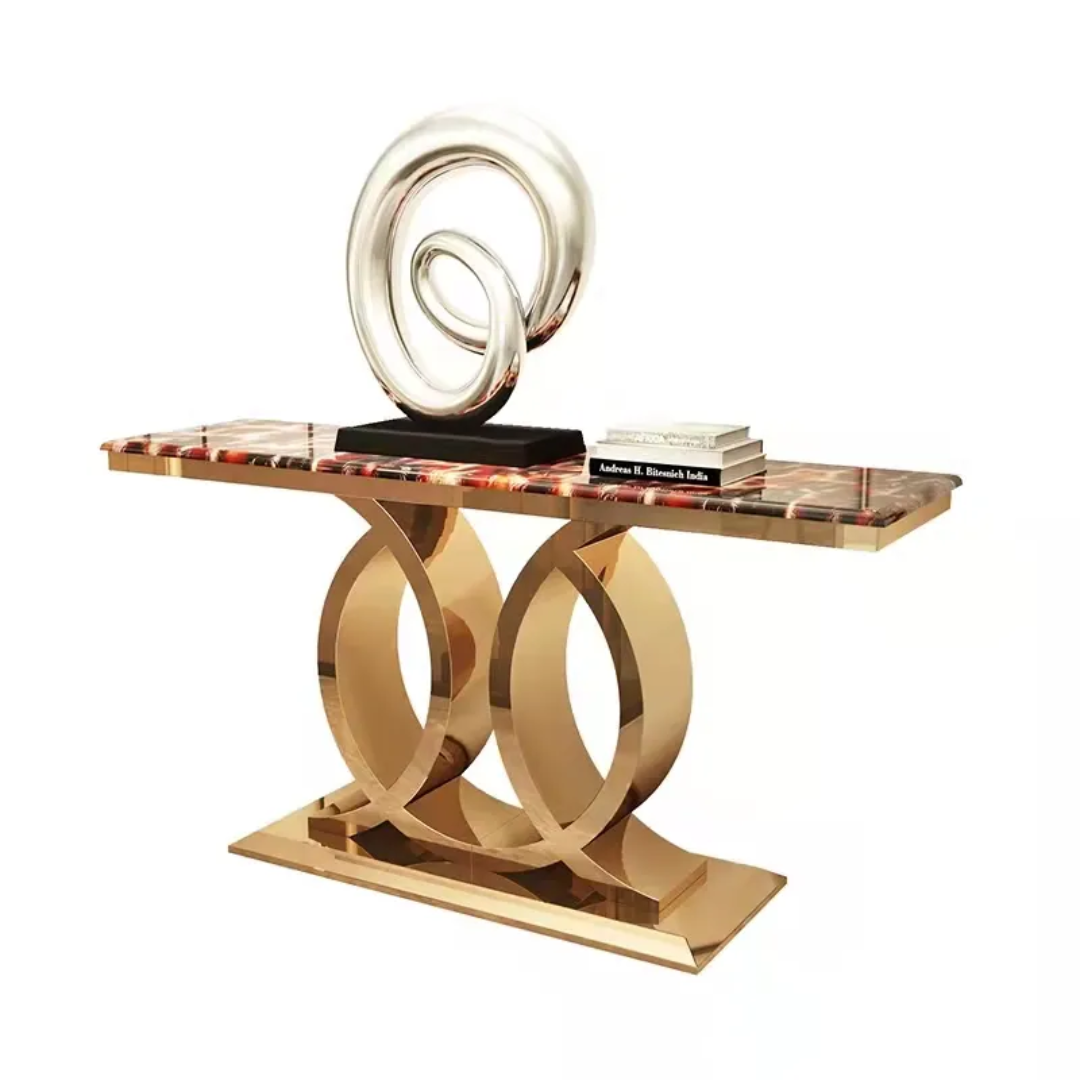 Decorative console table with gold circular legs and a marble top on a white background