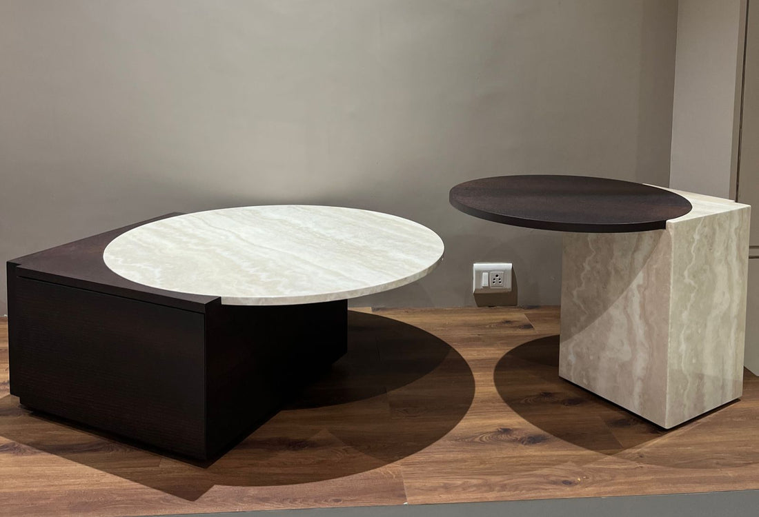 Two modern side tables with marble-like finishes on a wooden floor.